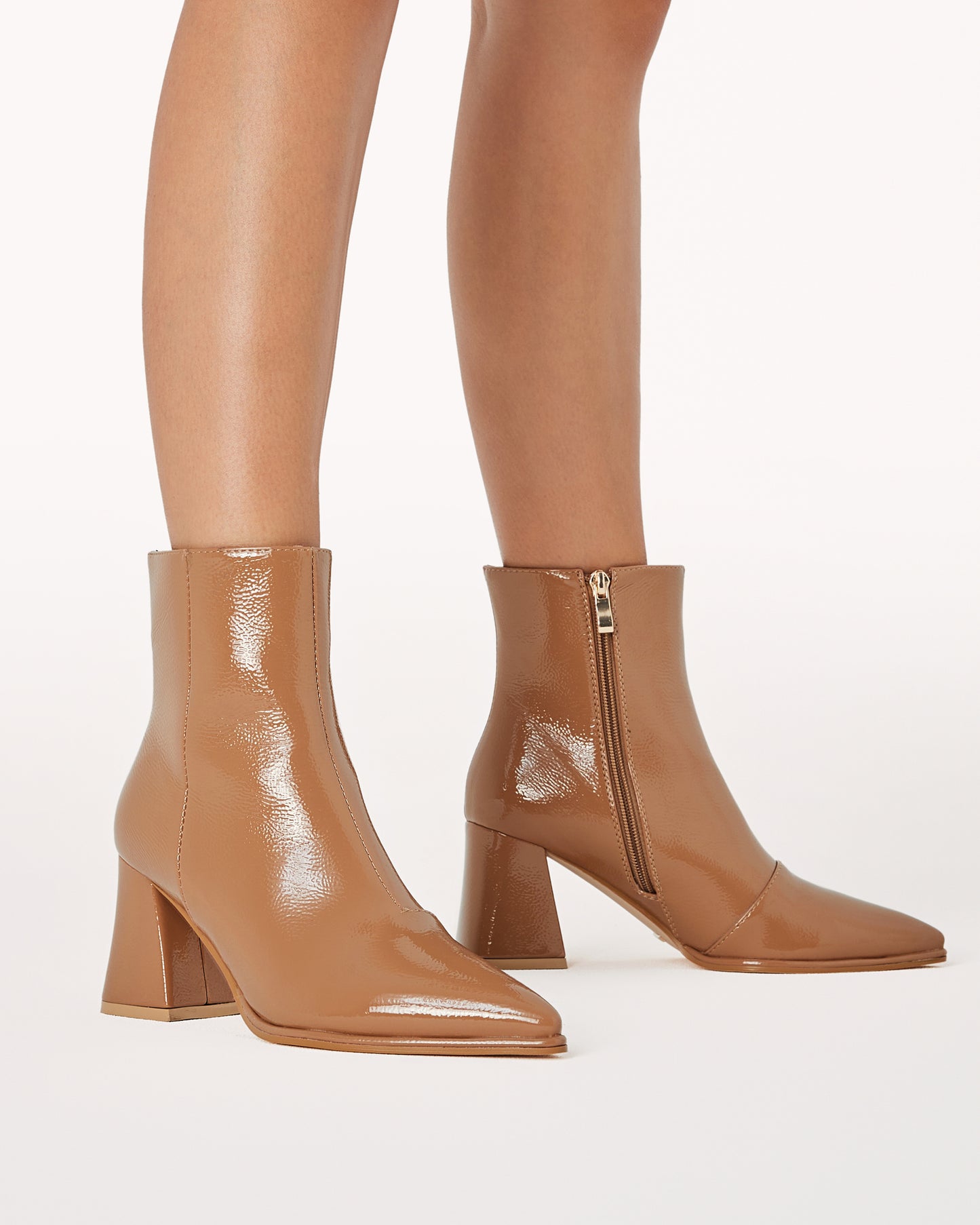 Chic ankle boot in a toffee crinkle patent and statement triangular block heel.