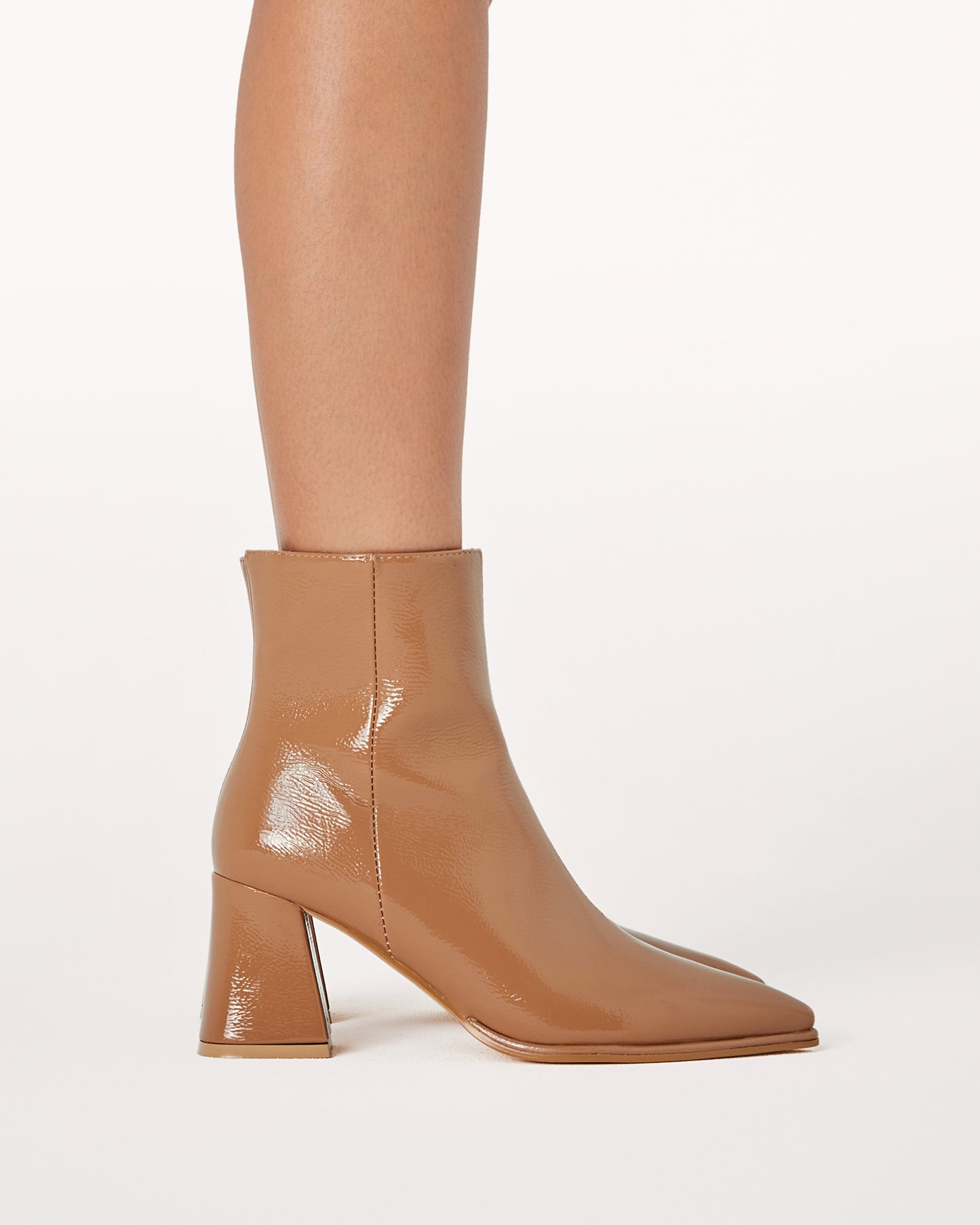 Chic ankle boot in a toffee crinkle patent and statement triangular block heel.