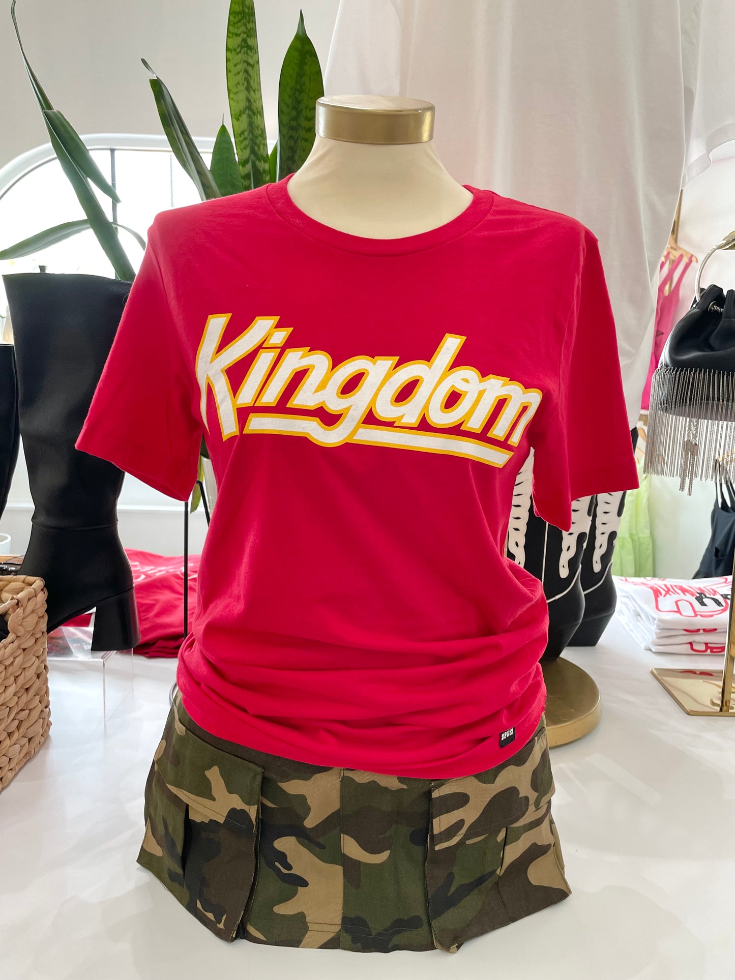 Red t-shirt with Kingdom written on front