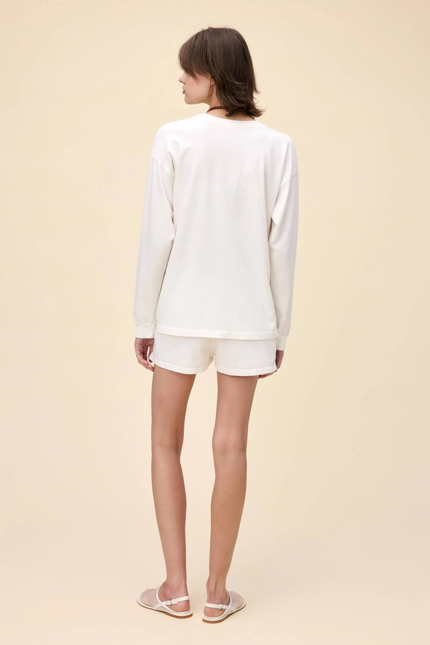 White Morgan Wallen Long Live Cowgirls graphic tee, featuring a vintage-inspired bronco riding print, bold red and blue lettering, and Western-style star details. Designed in a relaxed, oversized fit, this long-sleeve shirt is perfect for country music lovers and casual cowboy-inspired outfits.