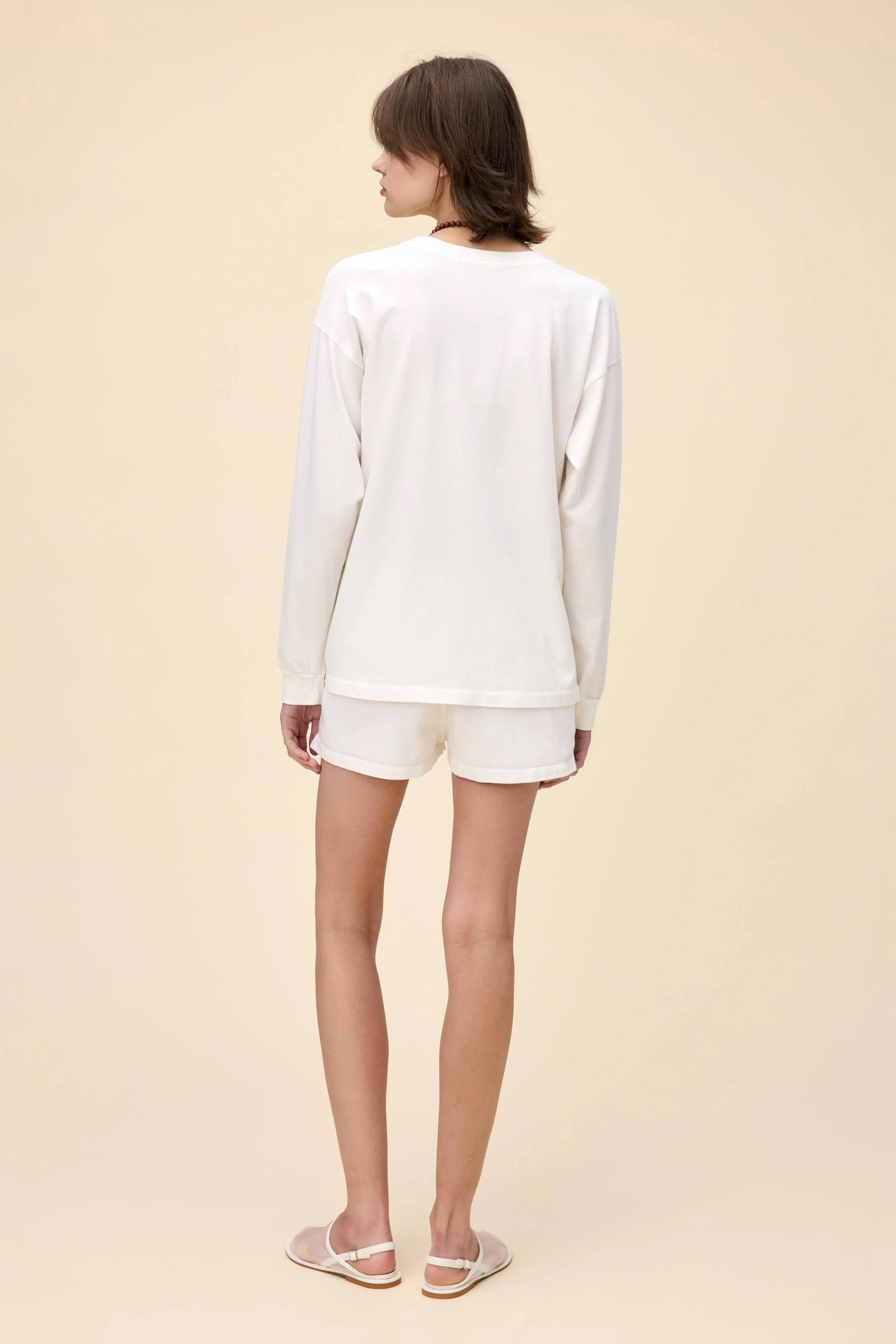 White Morgan Wallen Long Live Cowgirls graphic tee, featuring a vintage-inspired bronco riding print, bold red and blue lettering, and Western-style star details. Designed in a relaxed, oversized fit, this long-sleeve shirt is perfect for country music lovers and casual cowboy-inspired outfits.