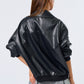 Person wearing a black leather jacket on a white background
