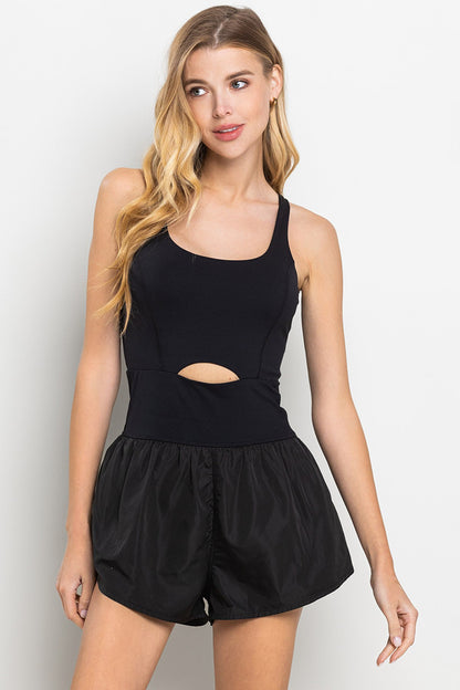 Black romper with elastic waistband, and small center cutout detail. 