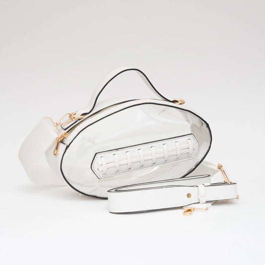 White handbag with gold accents on a light gray background