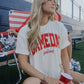 off-white t shirt with "gameday feeling" written in red on the front