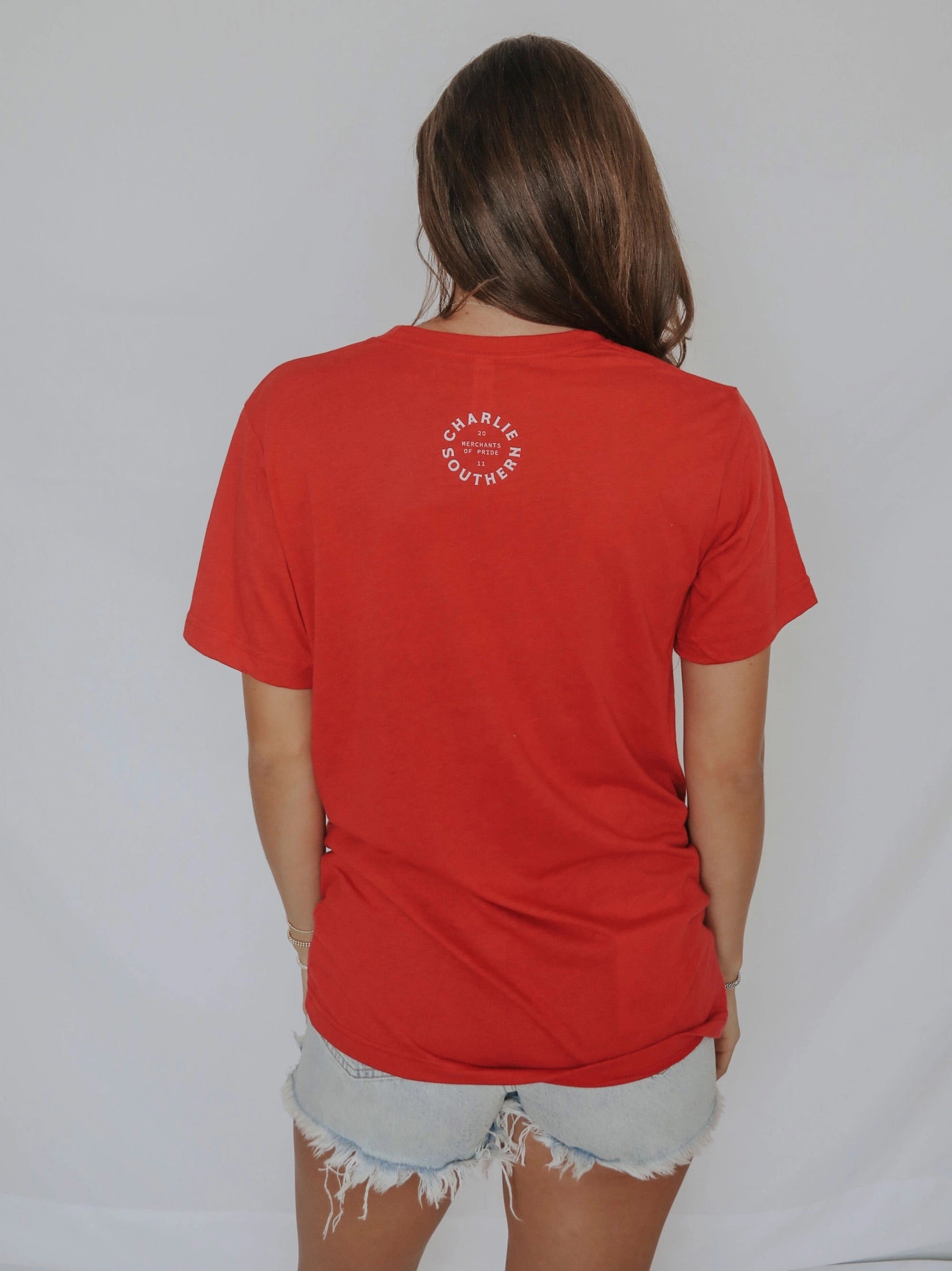 Red t-shirt with the brands logo on the back of hte t-shirt "charlie southern"