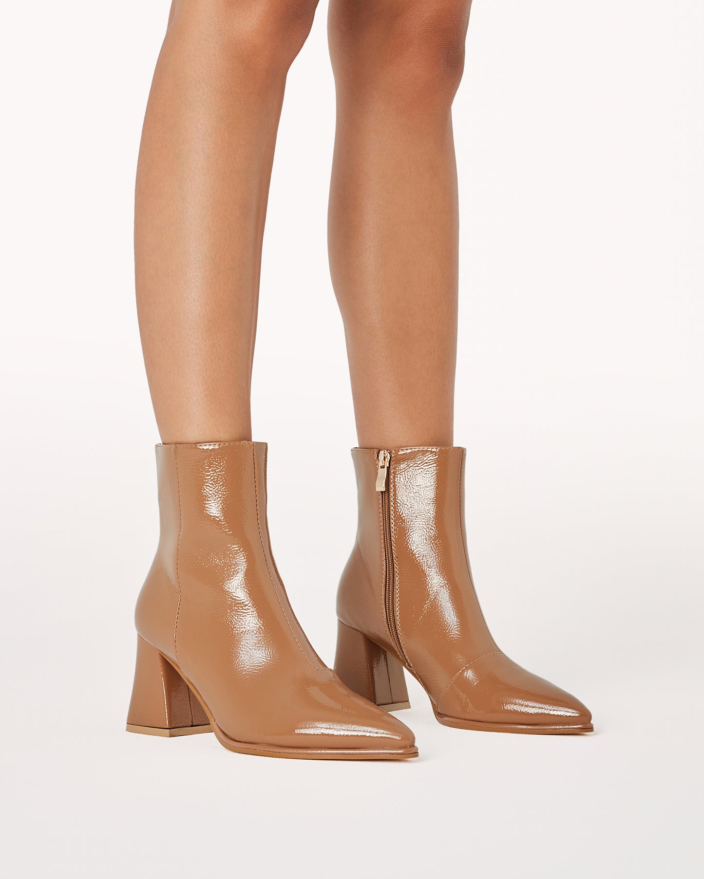 Chic ankle boot in a toffee crinkle patent and statement triangular block heel.