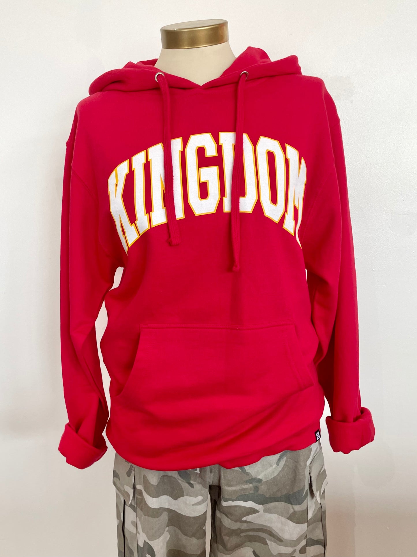 Red hoodie with Kingdom written on front