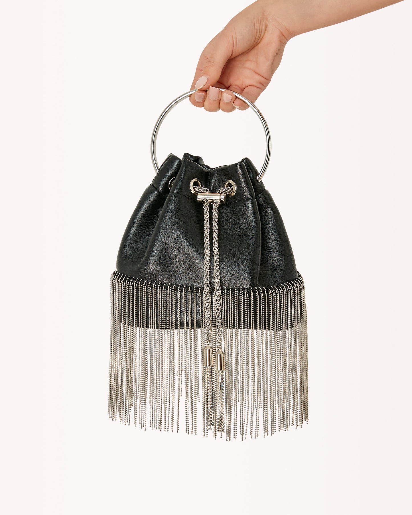 Black purse with a drawstring top closure, silver fringe along the bottom and a silver top handle