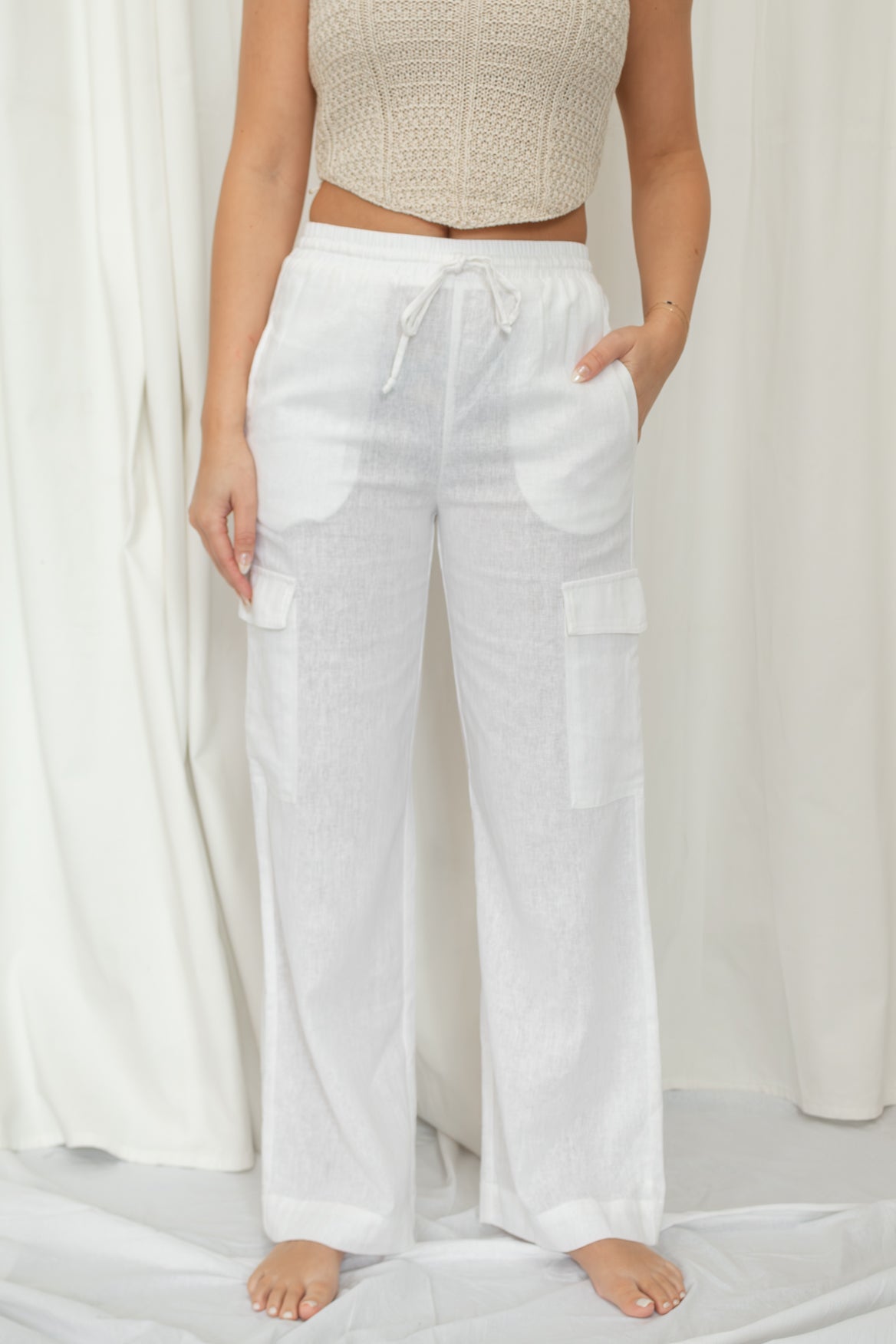 White linen pants with a drawstring waist