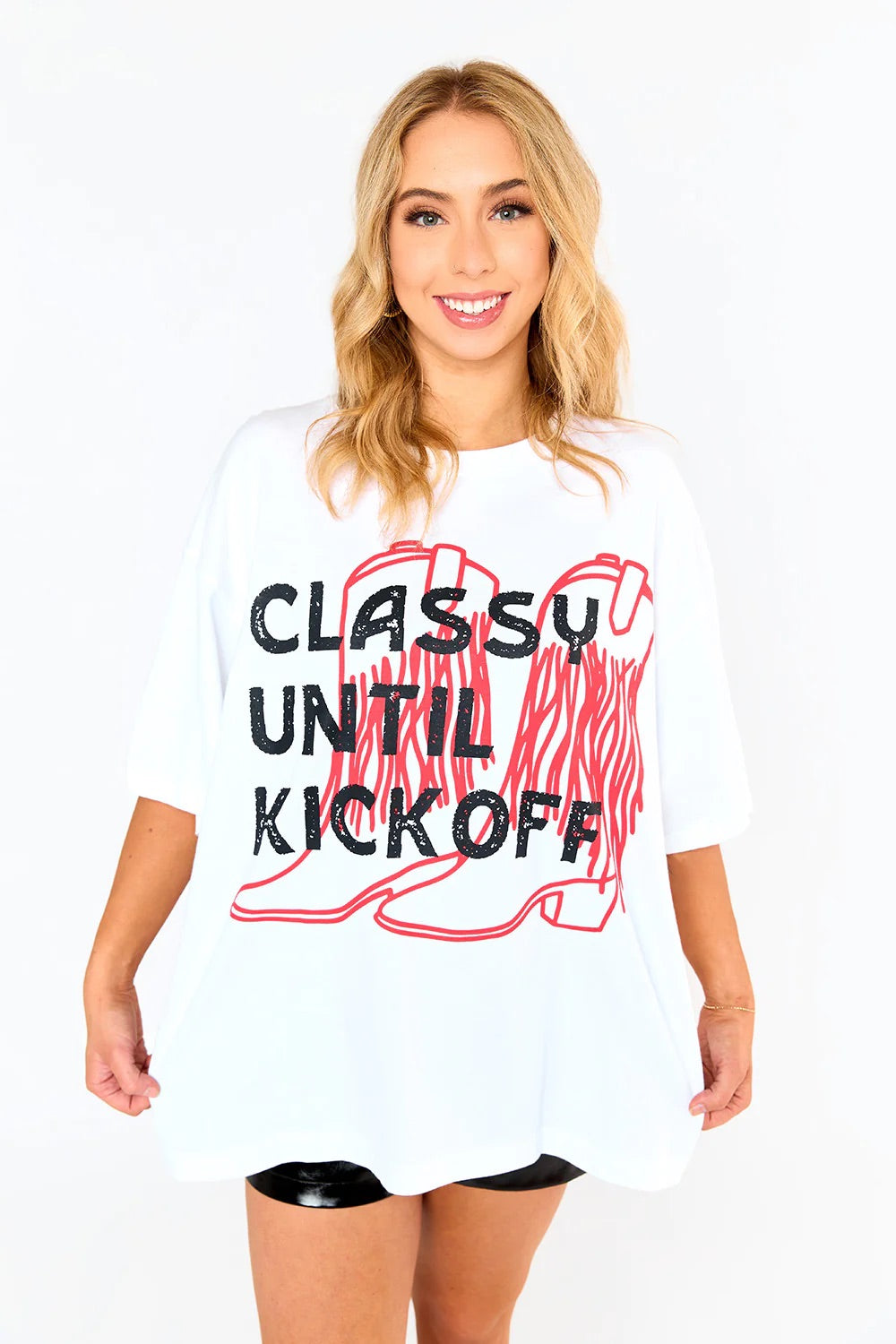 Oversized white t shirt with "classy until kickoff" on the front