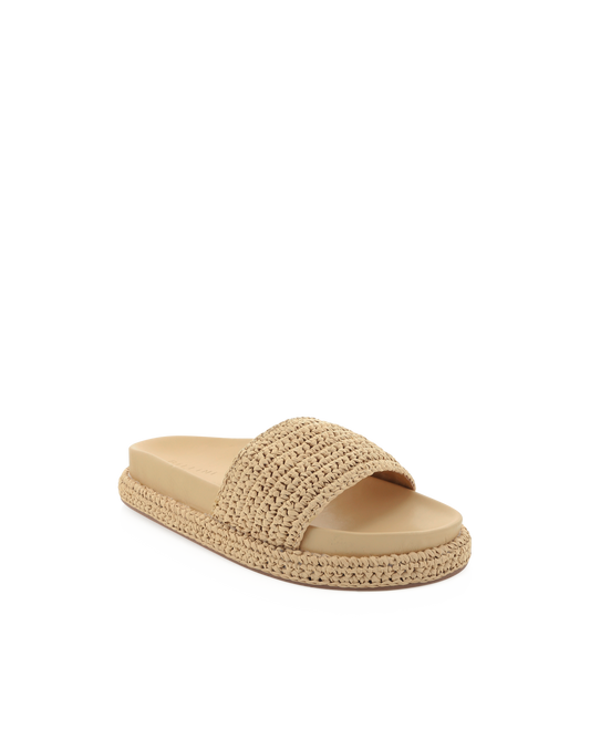 Natural raffia slide sandal featuring a wide woven strap and matching raffia-wrapped platform sole. This neutral slip-on sandal offers effortless style and comfortable cushioning, perfect for beach days, vacations, or casual warm-weather outfits.