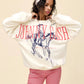 Vintage-inspired Johnny Cash graphic sweatshirt, featuring an oversized fit with bold red lettering and a hand-drawn cowboy sketch. The off-white crewneck design includes "Nashville, Tennessee" text, giving it a Western, country music vibe. Perfect for cozy, casual styling with a touch of retro charm.