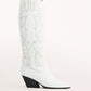 Chic and bold, these white western knee-high boots feature classic cowboy stitching with silver stud embellishments, a pointed toe, and a stacked angled heel. Perfect for country concerts, bachelorette parties, festivals, or trendy street style looks.