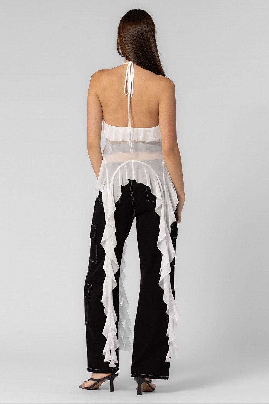 White sheer mesh halter neck top with a rosette, top ties in the front and features long ruffles.