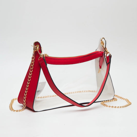 Red and white handbag with gold chain on a light gray background