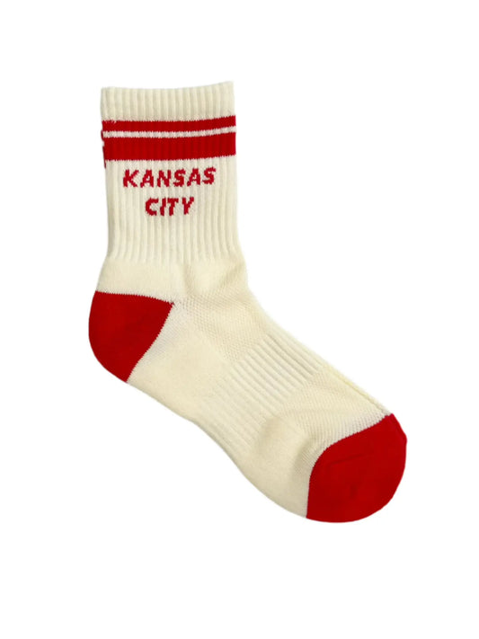 White sock with red accents and 'Kansas City' text on a white background