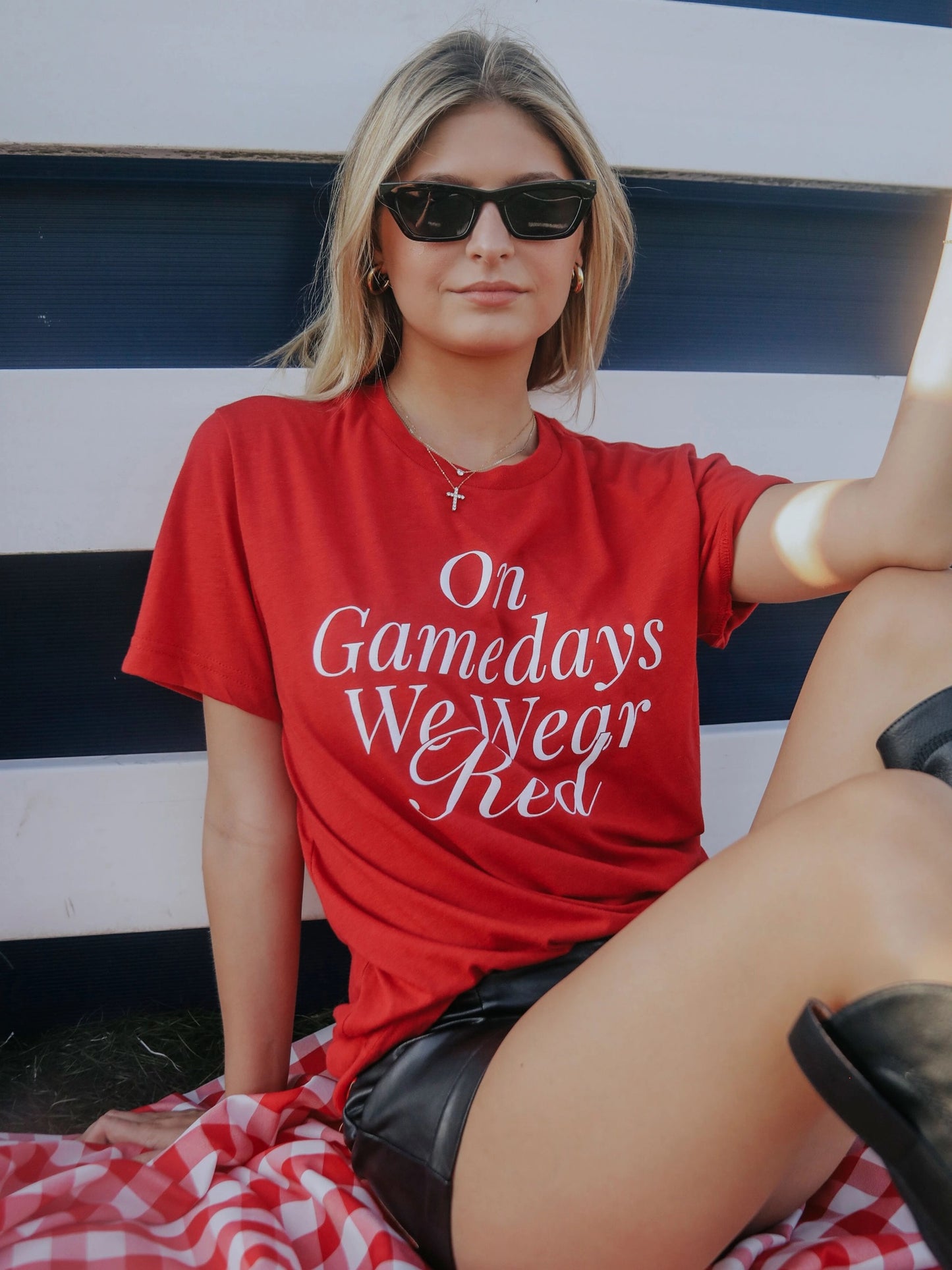 Red t-shirt with "on gamedays we wear red" on the front in white lettering
