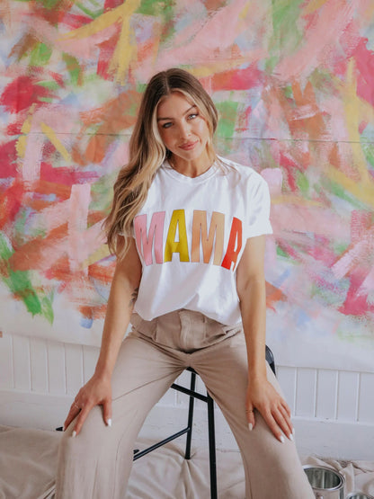 white t-shirt with MAMA in block multi colored letters