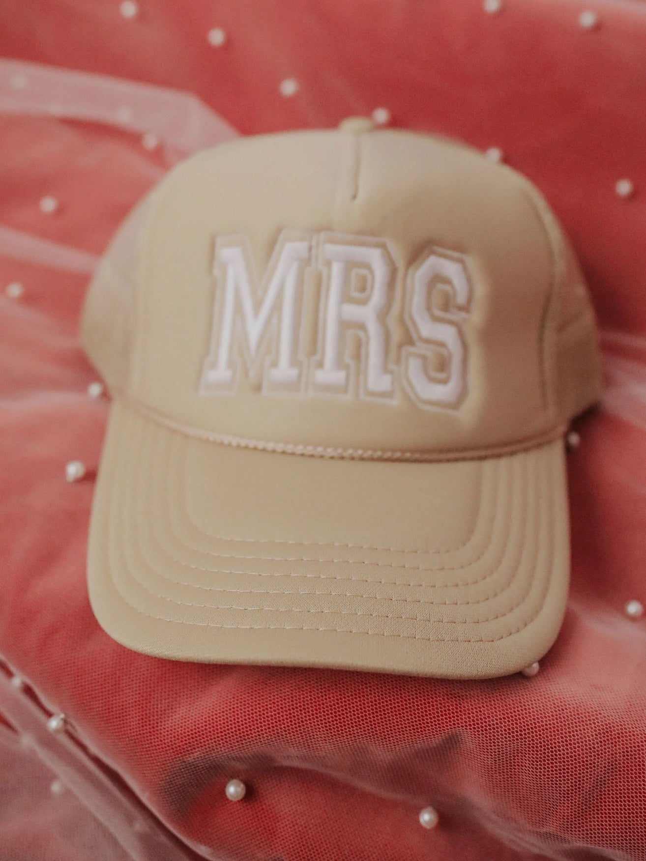 Tan trucker hat with "MRS" written in white lettering on the front