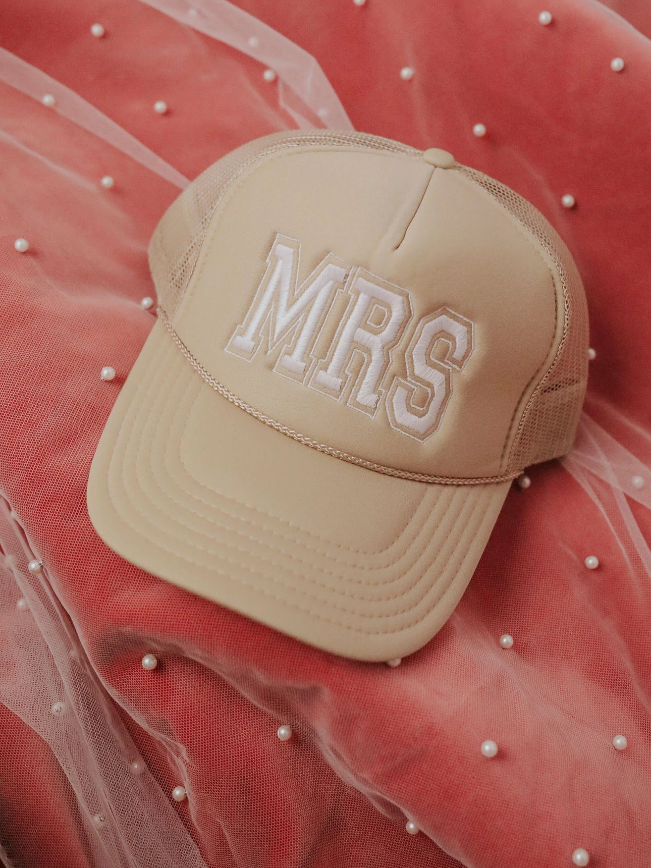 Tan trucker hat with "MRS" written in white lettering on the front